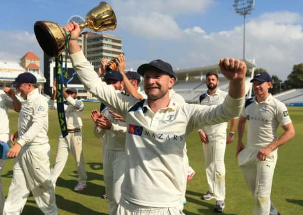 Yorkshire's Adam Lyth celebrates winning the Division One County Championship trophy during day four of the LV= County Championship Division One match at Trent Bridge, Nottingham.