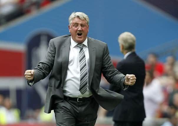 Hull City's manager Steve Bruce celebrates his side's second goal during the FA Cup Final at Wembley in 2014.