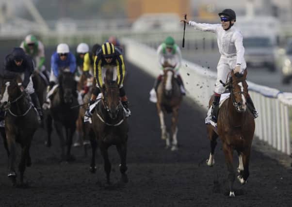 SWEET MEMORIES: Toast of New York, ridden by Jamie Spencer, crosses the finish line to win the UAE Derby at Meydan in Dubai back in March last year. Hull-born trainer Jamie Osborne is hoping his horse will line up in this years Dubai World Cup. AP/Kamran Jebreili.