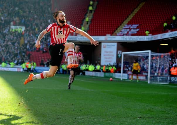 Sheffield United's John Brayford leaps into the air to celebrate scoring the second goal in the 6th round win over Charlton last season, one of many Cup shocks they have enjoyed in recent times.