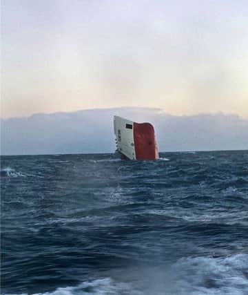 BEST QUALITY AVAILABLE

Undated handout photo issued by the RNLI Wick of the Cemfjord cargo ship after it overturned off the north coast of Scotland. PRESS ASSOCIATION Photo. Issue date: Saturday January 3, 2015. A passing ferry alerted Shetland Coastguard at around 2.30pm today after seeing the ship's upturned hull in the Pentland Firth. The Wick, Thurso, Longhope and Stromness RNLI lifeboats, the Coastguard rescue helicopter from Shetland, an RAF rescue helicopter and other vessels in the area were involved in the search. See PA story SEA Vessel. Photo credit should read: RNLI Wick/PA Wire

NOTE TO EDITORS: This handout photo may only be used in for editorial reporting purposes for the contemporaneous illustration of events, things or the people in the image or facts mentioned in the caption. Reuse of the picture may require further permission from the copyright holder.