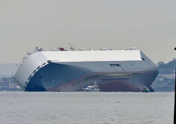 The Hoegh Osaka, a car carrier, is seen from Calshot in Hampshire