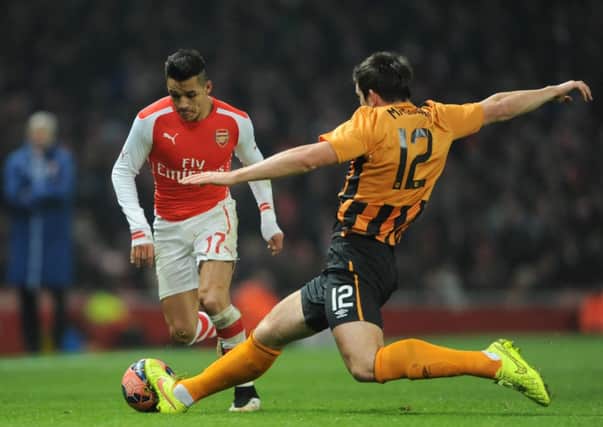 STRETCHED: Harry Maguire tries to quell Arsenals Alexis Sanchez. Of all the players Ive faced, he is right there at the top, said Maguire.