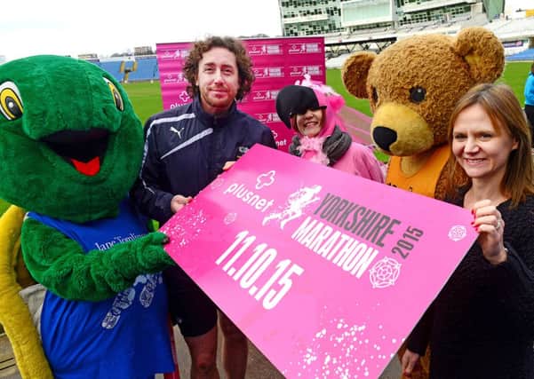 Yorkshire's Ryan Sidebottom with Caroline Richardson of sponsors Plusnet at the launch of the 2015 Yorkshire Marathon