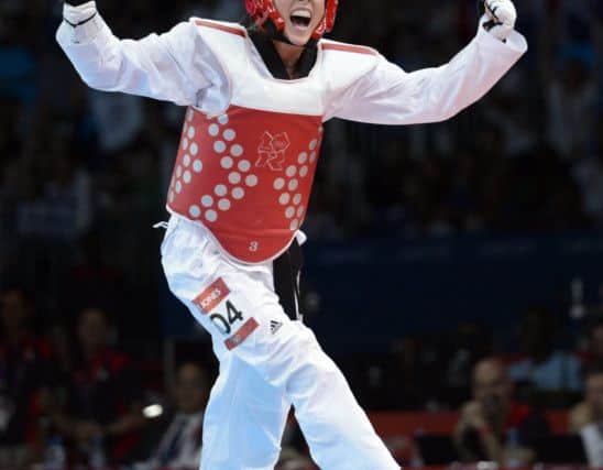 File photo dated 09/08/2012 of Great Britain's Jade Jones celebrates winning in her Women's -57kg Semi-Final. PRESS ASSOCIATION Photo. Issue date: Sunday December 16, 2012. Wales teenager Jade Jones kicked her way to Olympic glory and Lutalo Muhammad delivered a bronze medal to give British Taekwondo some welcome positive headlines at London 2012. See PA story SPORT Christmas Olympics Taekwando. Photo credit should read: Rebecca Naden/PA Wire