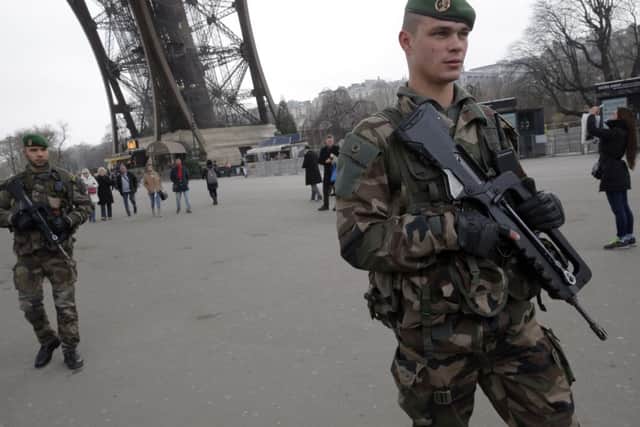French police stormed two hostage sites killing three gunmen as the death toll rose after days of bloodshed and terror in Paris.