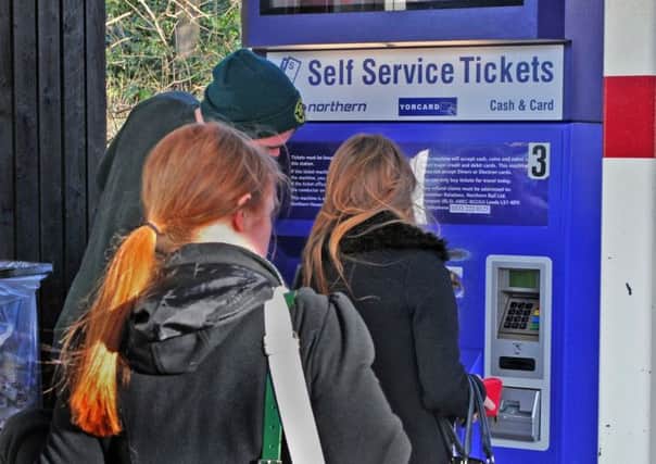 Passengers queue to use the ticket machine at Horsforth Train Station. PIC: Tony Johnson