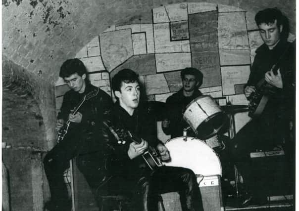 The Beatles play an early gig at the Cavern Club