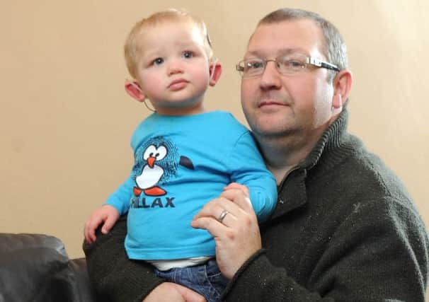 Lucas Carruthers, with his dad Scot