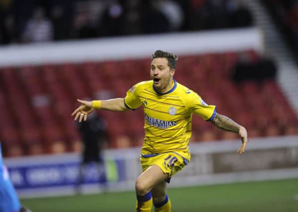 Chris Maguire celebrates the Owls' second goal.