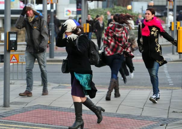Stormy conditions cause problems for pedestrians in Leeds on Friday.