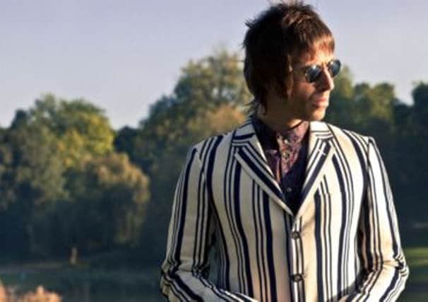 Liam Gallagher models a boating stripe jacket from the  Pretty Green label