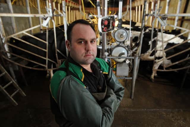 Dairy farmer Tom Rawson in his milking parlour at Thornhill Hall Farm, Hall Lane, Dewsbury.