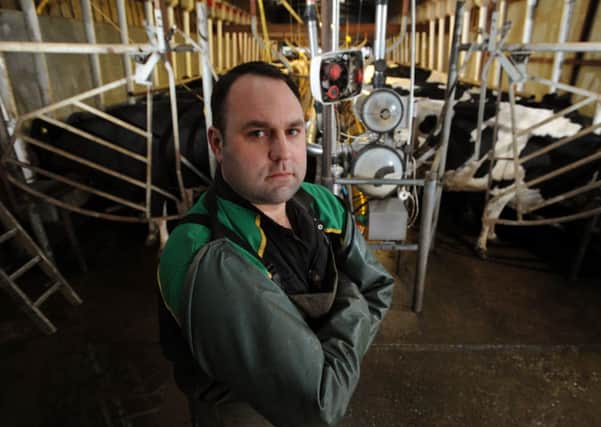 Dairy farmer Tom Rawson in his milking parlour at Thornhill Hall Farm, Hall Lane, Dewsbury.