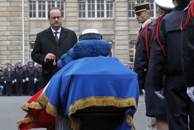 French President Francois Hollande during a ceremony to pay tribute to the three police officers killed in the attacks, in Paris