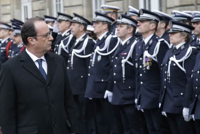French President Francois Hollande during a ceremony to pay tribute to the three police officers killed in the attacks, in Paris
