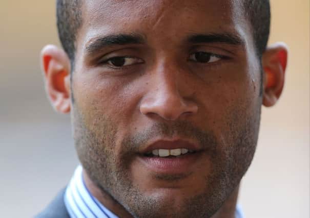 Clarke Carlisle is awake in hospital after being seriously injured in a collision with a lorry.