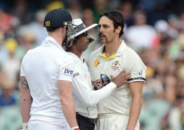 England's Ben Stokes (left) exchanges words with Australia's Mitchell Johnson (right) during day four of the Second Test Match at the Adelaide Oval, Adelaide, Australia.