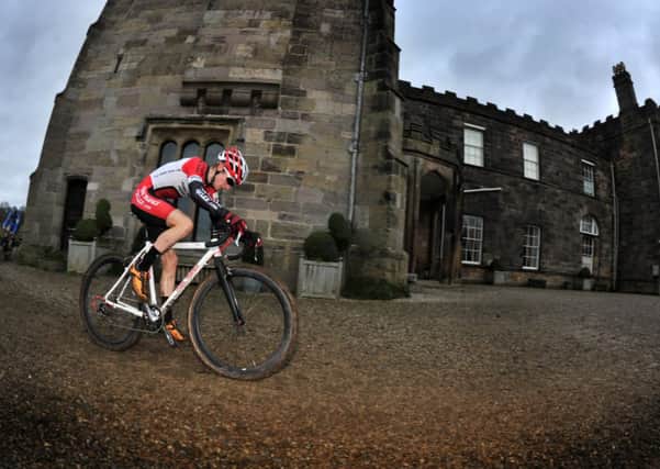 Alfie Moses from Keighley races through the castle courtyard during the New Year's Day Cyclo Cross race at Ripley Castle. He has been selected to race for Great Britain at the world championships in the Czech Republic at the end of the month. (Picture: Bruce Rollinson)