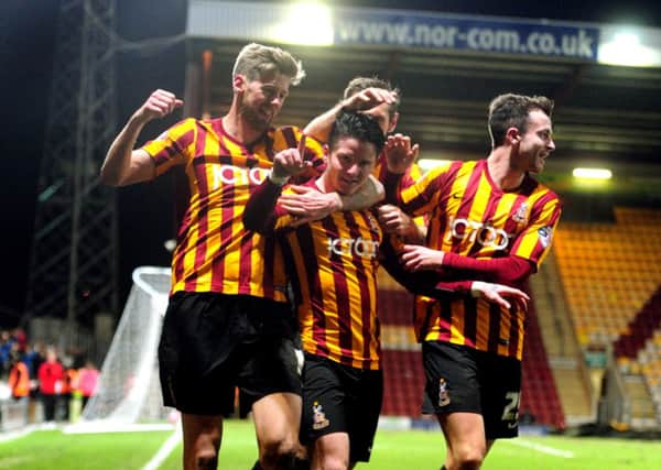 GO FOURTH: Bradford City's Billy Knott celebrates his team's fourth and final goal against Millwall with his team-mates. Picture: Tony Johnson.