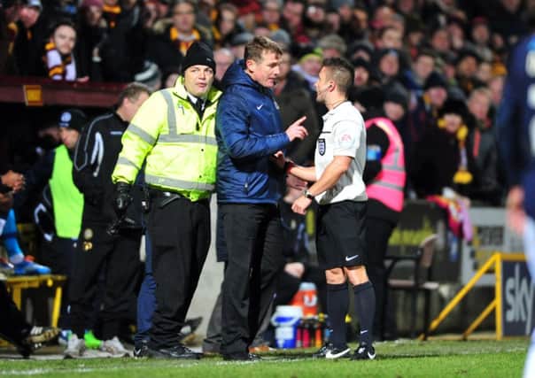 GO: Referee James Adcock sends off City manager Phil Parkinson at Valley Parade on Wednesday night. Picture: Tony Johnson