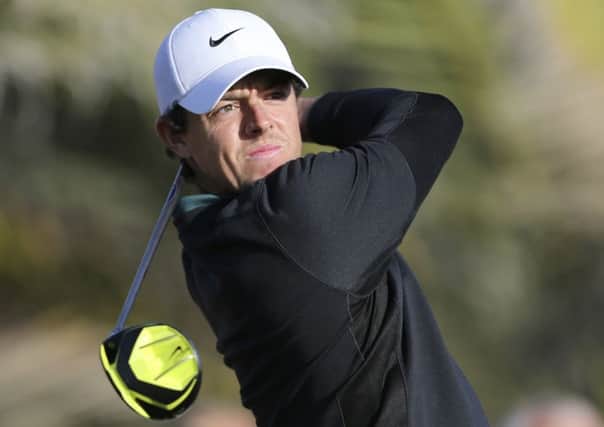 Rory McIlroytees off on the 14th hole during the first round of the Abu Dhabi Championship. (AP Photo/Kamran Jebreili)