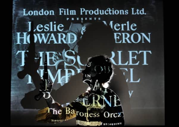 Hannah Phillip  in front of opening credits of The Scarlet Pimpernel