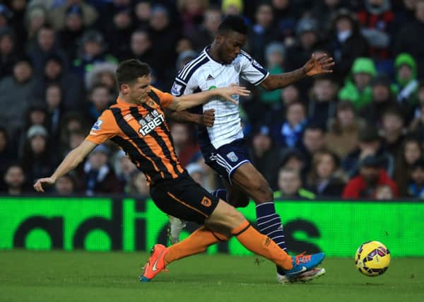 STAY POSITIVE: Defender Alex Bruce, seen in action against West Brom last week, is confident Hull City can beat the drop.