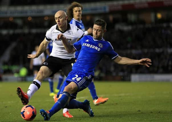 Derby County striker Conor Sammon, in white, has ended a loan spell at Ipswich and joined Rotherham United (Picture: Nick Potts/PA).
