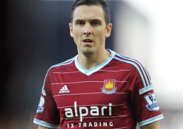Stewart Downing of West Ham United with their shirt sponsored by Alpari FX Trading