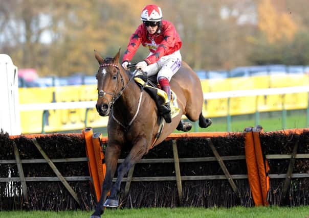The New One, ridden by Sam Twiston-Davies, on the way to victory in the Betfair Price Rush Hurdle at Haydock in November 2014. Picture: John Giles/PA.