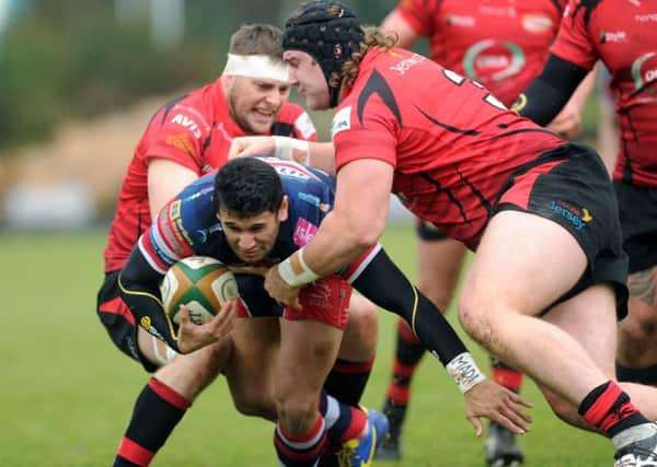 Doncaster's Tomasi Palu is tackled by Jersey's Michael Noone and Harry Williams. (Picture: Jonathan Gawthorpe).