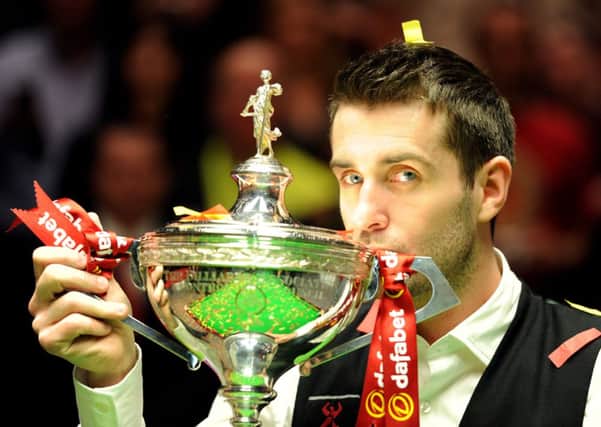 Mark Selby celebrates after winning the World Championship at The Crucible, Sheffield.