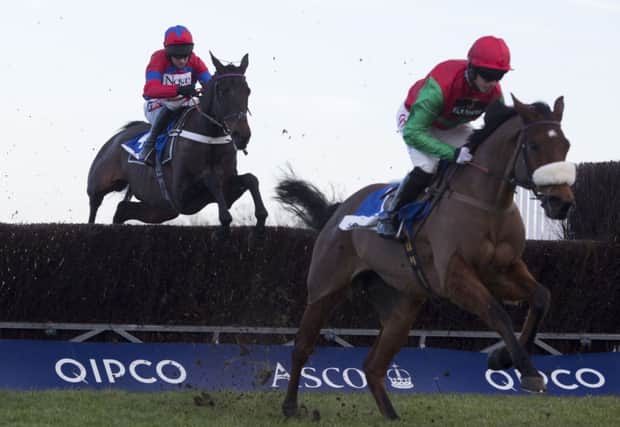 Dodging Bullets and Noel Fehily, right, lead Sprinter Sacre and Barry Geraghty before going on to win the Sodexo Clarence House Steeple Chase at Ascot on Saturday. Picture: Julian Herbert/PA.