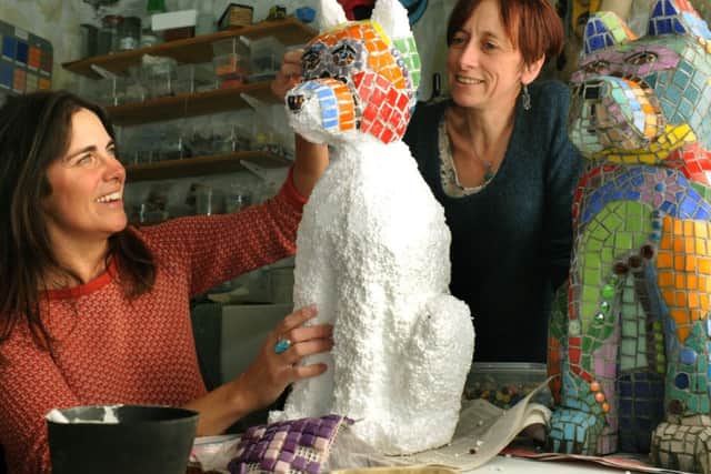 Clare Harris making a mosaic dog similar to the one made by  mosaic artist Frances Taylor  (right).