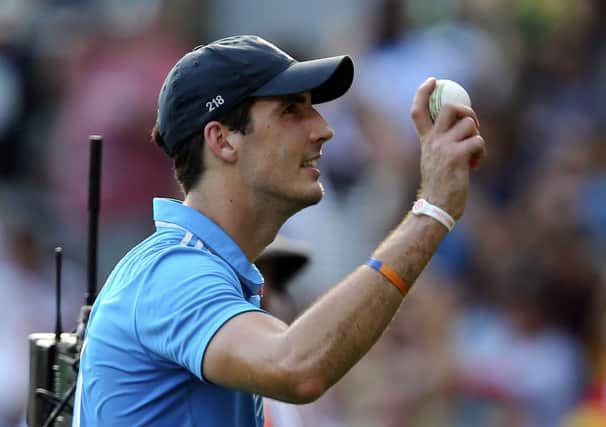 England's Steven Finn waves to the crowd after he took five wickets during the one-day International cricket match between England and India in Brisbane. (AP Photo/Tertius Pickard)