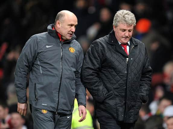 Steve Bruce (right), then at Sunderland, chats with ex-Manchester United assistant Mike Phelan in a game at Old Trafford in December 2010