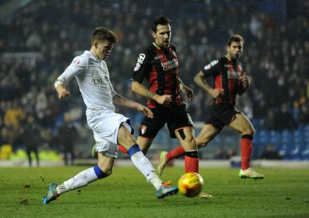 UP: Sam Byram puts through a cross past Tommy Elphick at Elland Road on Tuesday night.  Picture: Bruce Rollinson