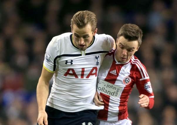 Sheffield United's Stefan Scougall battles for the ball with Tottenham Hotspur's Harry Kane at White Hart Lane on Wednesday (Picture: Nick Potts/PA Wire).