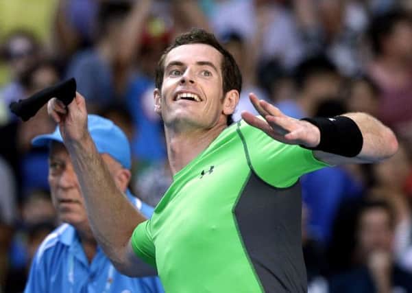 THROUGH: Andy Murray throws an armband to the crowd after defeating Joao Sousa in Melbourne.
