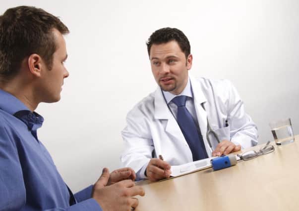 A Generic Photo of a man visiting his doctor.
