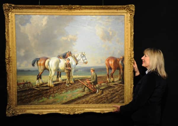 Pat Stanley from Blackbrook Gallery with a oil on canvas painting, 'The Plough Team'  by Harrogate artist  Wright Barker c1930,  at The Harrogate Antiques and Fine Art Fair
