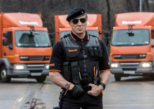 Stallone with bread vans as he appears in the commercial