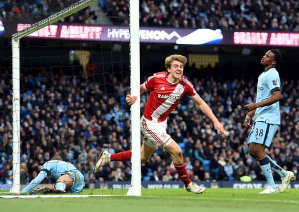 Patrick Bamford is jubilant after giving Middlesbrough the lead against Manchester City at Etihad Stadium (Picture: Martin Riickett/PA).