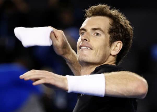 Andy Murray of Britain throws a wristband to the crowd after defeating Grigor Dimitrov of Bulgaria in their fourth round match at the Australian Open. (AP Photo/Vincent Thian)