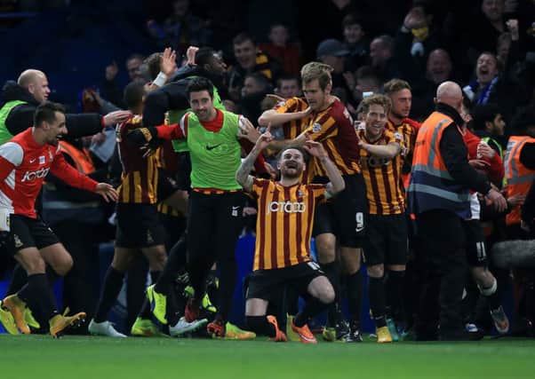 Bradford City's Mark Yeates, front, celebrates with team-mates after scoring the final goal in their staggering 4-2 FA Cup win at Chelsea (Picture: John Walton/PA Wire).