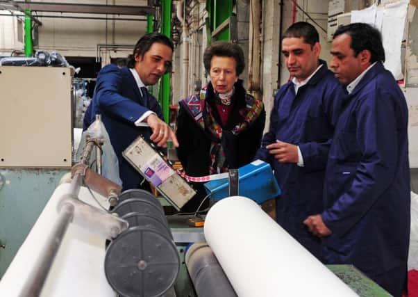 23 January 2015.......    HRH Princess Anne is given a tour of SKA Textiles in Huddersfield by Managing Director  Zeb Parvez, left. TJ100683b Picture by Tony Johnson