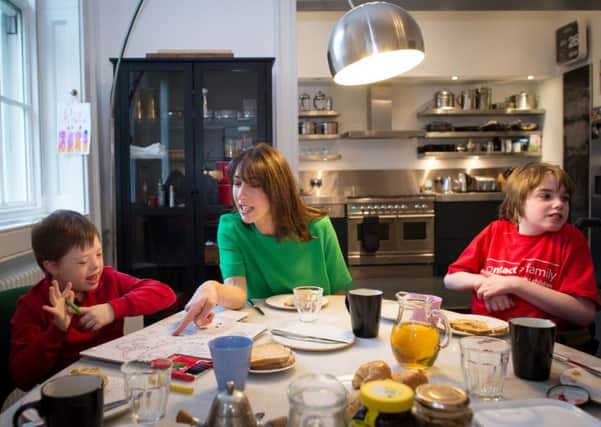 Samantha Cameron has breakfast in her Downing Street apartment with Philip Kiley (left), eight, from Chorley in Lancashire, and Stevie Tyrie, eight, from Manchester