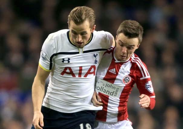 Sheffield United's Stefan Scougall battles with Tottenham Hotspur's Harry Kane during last week's first leg of the Capital One Cup semi-final (Picture: Nick Potts/PA Wire).