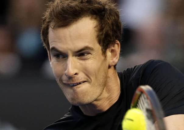 Andy Murray of Britain makes a backhand return to Nick Kyrgios of Australia during their quarter-final match at the Australian Open. (AP Photo/Lee Jin-man)